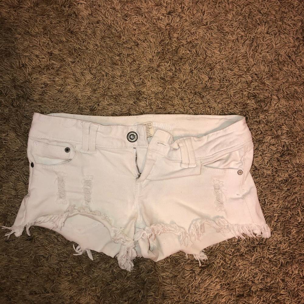 White ripped shorts